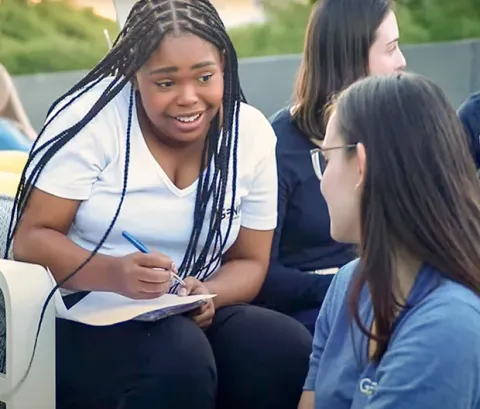 A Genius tutor teaching a one-on-one lesson