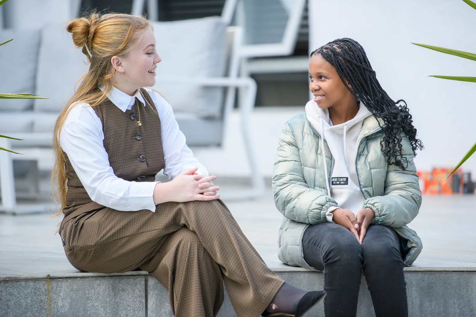 An Education Leader and student sharing a warm conversation